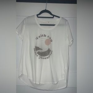 Maurice’s shirt “Faith Can Move Mountains”